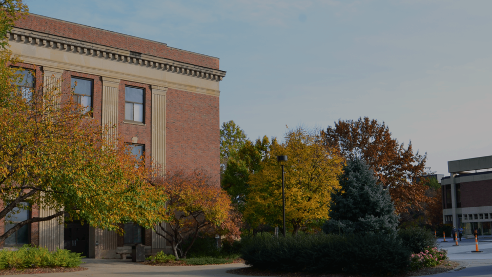 Image of Andrews Hall in autumn. Photo credit - Erin Chambers; links to news story