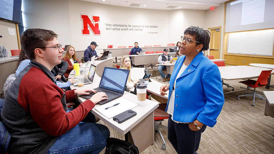 Business classroom with students listening to faculty