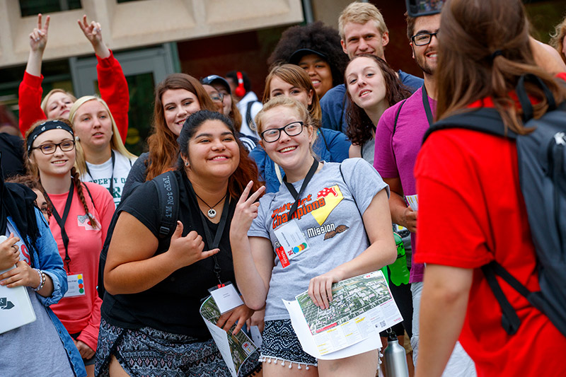 Group of smiling first-year students posing at Nebraska Union