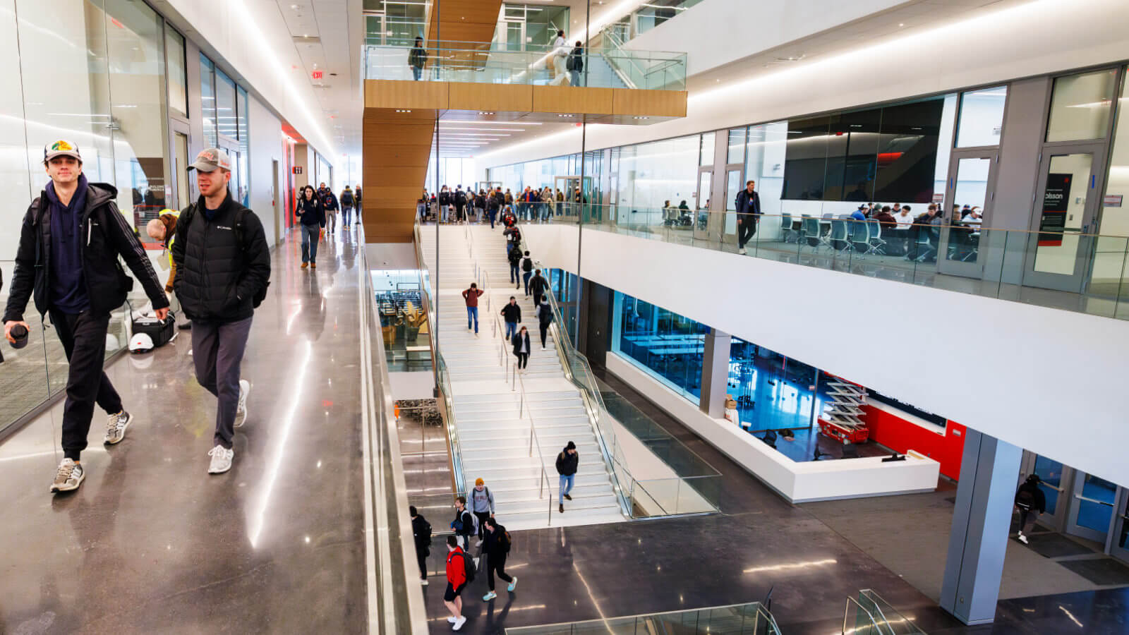 Students walk inside Kiewit Hall